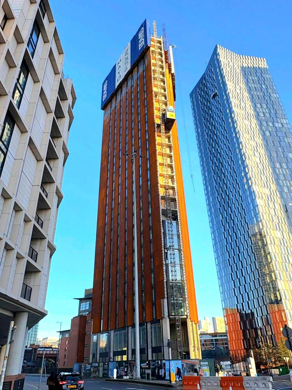 Fusion, Manchester: weathering steel and glass residential tower under construction
